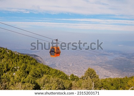 Two ropeway cabs are going up. Denizli, Bagbasi Royalty-Free Stock Photo #2315203171