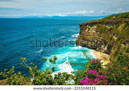 Beautiful Uluwatu coast with rocks and ocean waves, Bali, Indonesia Royalty-Free Stock Photo #2315248115