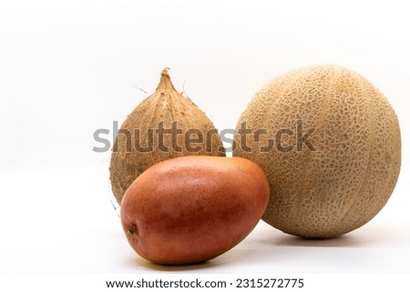 Melon, coconut and mango isolated on white background.
Natural, Organic, Fruit Market. Selective focus.