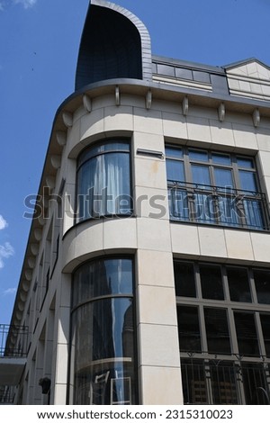 rounded corner of a modern building with large windows