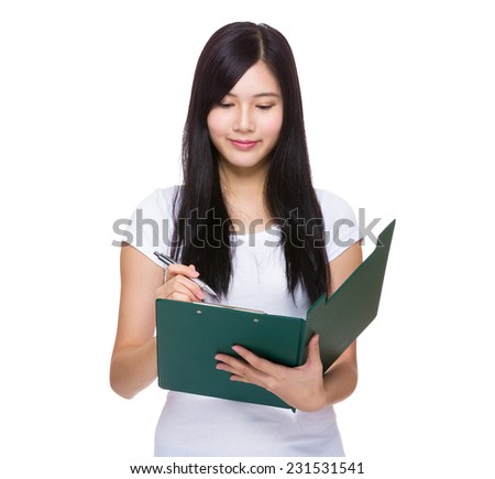 Asian woman write on clipboard