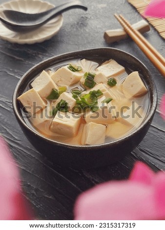 Miso soup. It is a traditional Japanese soup consisting of a dashi stock into which softened miso paste is mixed. In addition, there are many optional ingredients