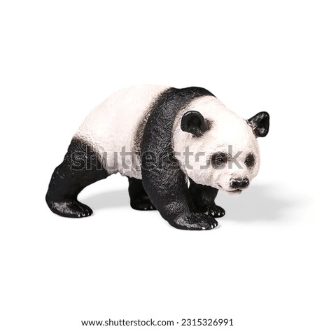 Closeup shot of a miniature panda animal toy on a white background