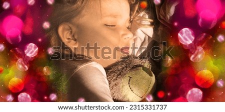 Sleeping little girl in pjamas with teddy bear  on bed, glittering bokeh flares, fairy dreaming. Banner
