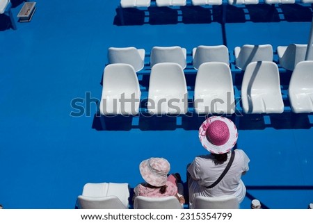 A young mother with her daughter on the deck of a ferry boat. Summer Holidays. Αrtistic photography. Euboea. Greece. 