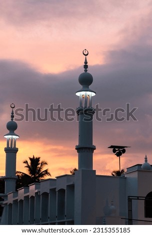 Colourful sunset sky with mosque view, Ramadan and Eid Mubarak background, hijri new year and Islamic new year image Royalty-Free Stock Photo #2315355185
