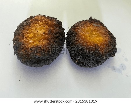 Nuggets that are cooked too long so that they become burnt and black