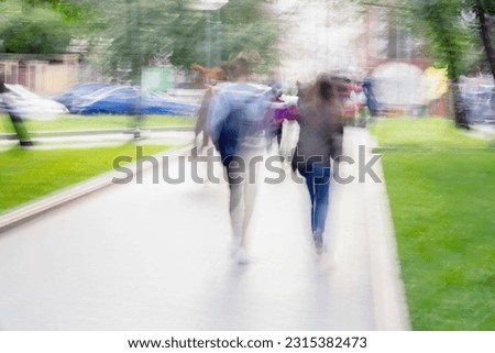Abstract of anonymous Young people walking on the city alley, summer sunny day, blurred background