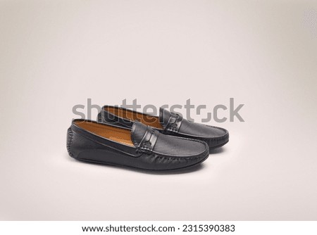 Different casual male shoes on color background