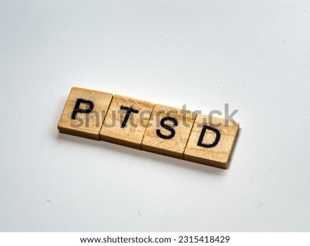 Photo of abbr PTSB on wood squares