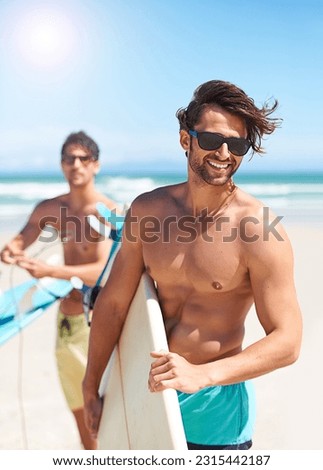 Beach, travel and man surfing friends outdoor together for summer vacation or holiday trip overseas. Surf, sea or fun with a shirtless young male surfer in sunglasses and friend bonding on the coast