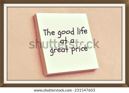Text the good life at a good price on the short note texture background