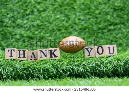 American Football with Thank You  on green grass