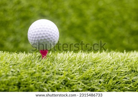 Golf ball is on green grass