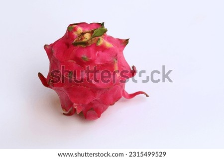 Close up image of red dragon fruit isolated on white background