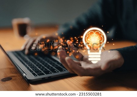 Businessman hand holding light bulb, concept of new ideas with innovation and creativity. intellectual property concept