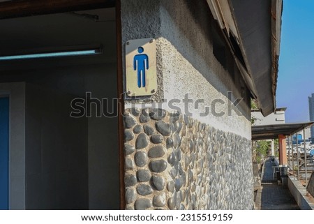 male image sign on toilet for men