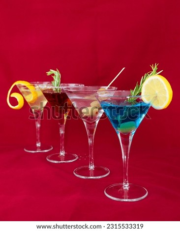 martini rosso bianco d'ore rosato extra dry diero varieties spices fruits party invitation organization bar night club pre-dinner snack elegance yellow red green blue alcohol glass drink coctail cold  Royalty-Free Stock Photo #2315533319