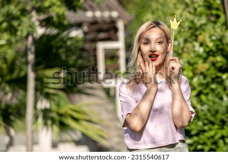 cute girl young lovely pretty blonde girl in hat in the summer at the park shocked Royalty-Free Stock Photo #2315540617