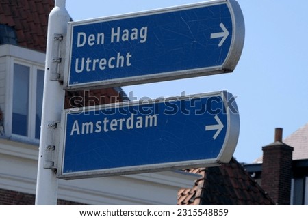 road sign to Amsterdam in the Netherlands