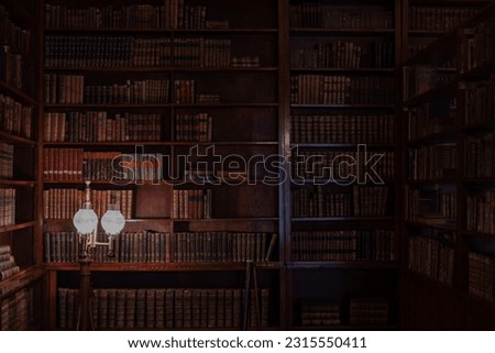 old library background, old books on bookshelves,  retro style Royalty-Free Stock Photo #2315550411