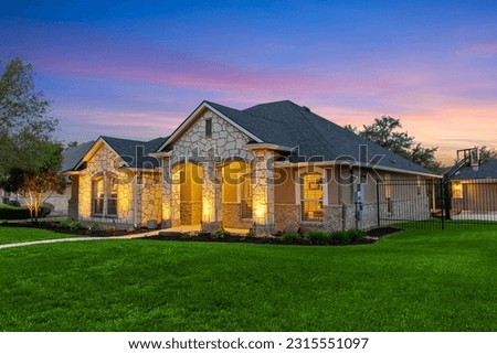 An American home at sunset  Royalty-Free Stock Photo #2315551097