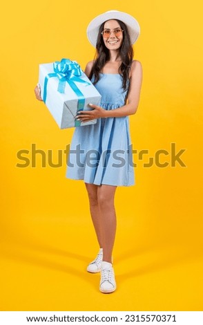 birthday woman hold present at studio. birthday woman hold present on background.