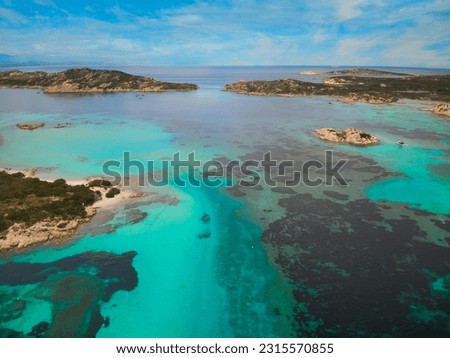 View from above stunning aerial view of La Maddalena archipelago Porto Madonna with Budelli and Santa Maria bathed by a turquoise and clear waters. Sardinia, Italy.