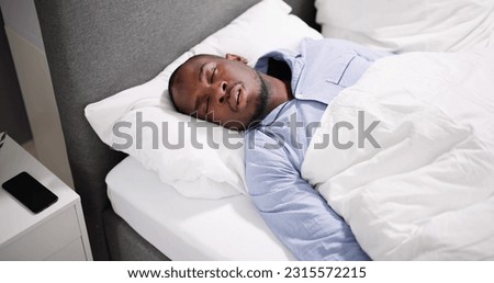 African American Man With Sleep Apnea Snoring Royalty-Free Stock Photo #2315572215