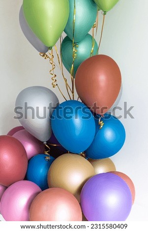 Multicolored balloons. Bunch of bright balloons and space for text against white background.