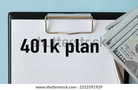 Notebook with word 401k plan on financial background