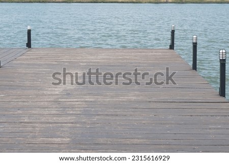 Wooden bridge floor for tourists to walk and enjoy the view in the pool.
