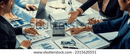 Auditor and accountant team working in office, analyze financial data and accounting record with calculator. Accounting company provide finance and taxation planning for profitable cash flow. Insight Royalty-Free Stock Photo #2315620551