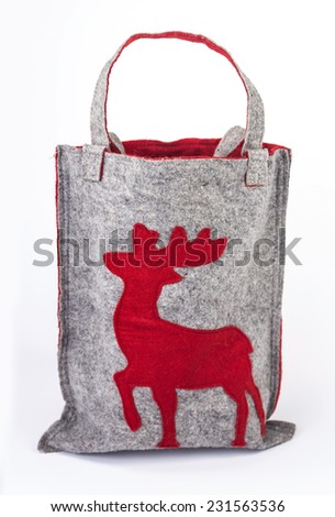 Christmas woolen bag with red silhouette of deer. Isolated on white background.