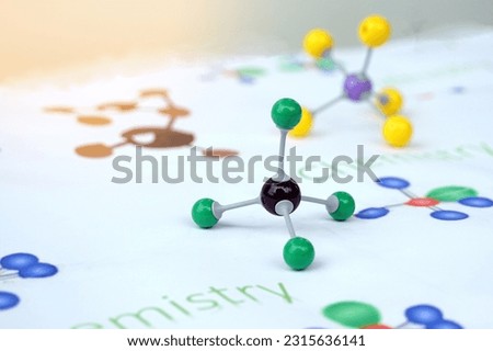 Simulate Shape of covalent molecules on english alphabet background Written in the text "Chemistry" and drawing molecular shapes. Soft and selective focus.                                     Royalty-Free Stock Photo #2315636141