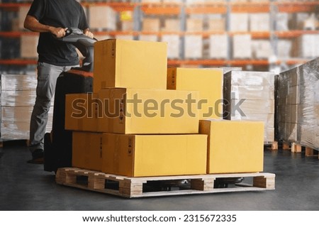 Workers Unloading Package Boxes on Pallets in Warehouse. Electric Forklift Pallet Jack Loader. Shipping Supplies. Supply Chain Shipment Goods. Distribution Warehouse Logistics Royalty-Free Stock Photo #2315672335
