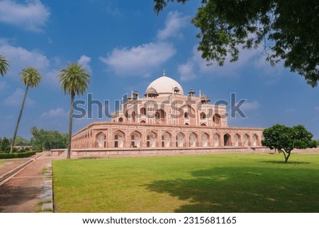 Large lawn in front Humayun's Tomb and the blue sky. Humayun's tomb is the tomb of the Mughal Emperor Humayun in Delhi, India. Royalty-Free Stock Photo #2315681165