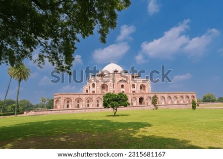 Large lawn in front Humayun's Tomb and the blue sky. Humayun's tomb is the tomb of the Mughal Emperor Humayun in Delhi, India. Royalty-Free Stock Photo #2315681167