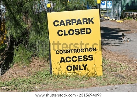 Yellow and black car park closed sign