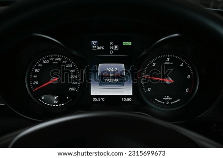 Mileage distance on the car dashboard digital speedometer car miles Royalty-Free Stock Photo #2315699673