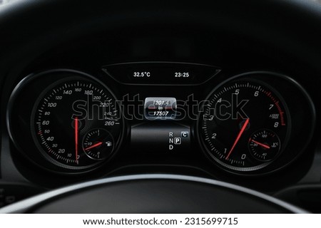 Mileage distance on the car dashboard digital speedometer car miles Royalty-Free Stock Photo #2315699715