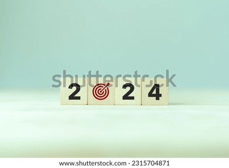 2024 goals of business or life. Wooden cubes with 2024 and goal icon on smart background. Starting to new year. Business common goals for planning new project, annual plan, business target achievement Royalty-Free Stock Photo #2315704871