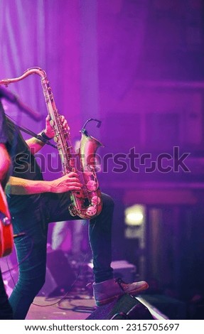 sax playing in a concert Royalty-Free Stock Photo #2315705697