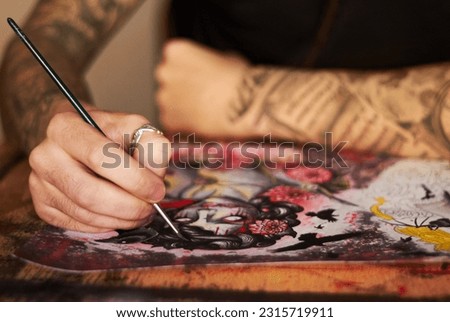 Art, paint and creative with a woman tattoo artist closeup in a studio to design a piece of artwork. Hand, canvas and a female painter using color ink while painting a picture closeup for expression
