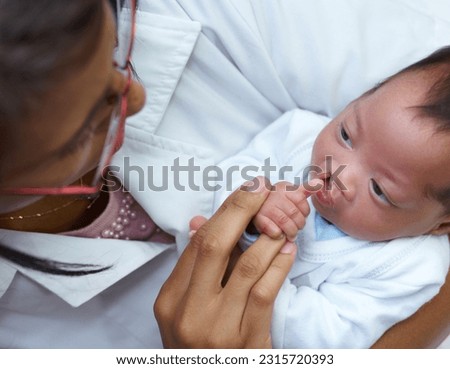 Healthcare, cleft lip and a pediatrician with a baby in the hospital for insurance, care or treatment. Medical, children and a doctor woman holding a newborn with a disability in a health clinic