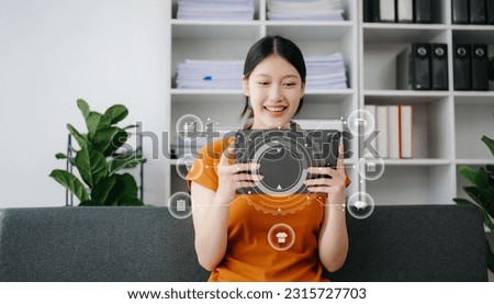 Woman using smart phone for mobile payments online shopping,omni channel,sitting on table,virtual icons graphics interface screen 
