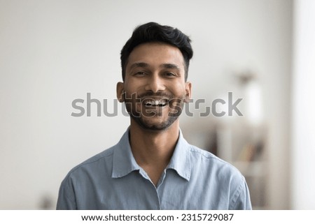 Happy handsome young Indian man head shot front portrait. Cheerful successful entrepreneur, startup leader, business professional in casual looking at camera with toothy smile Royalty-Free Stock Photo #2315729087