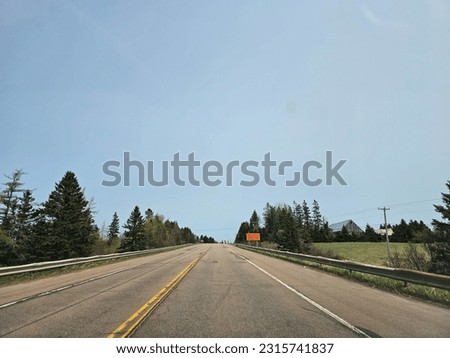 An open highway on a clear spring day.