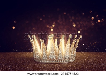 low key image of beautiful queen or king crown over glitter table. fantasy medieval period Royalty-Free Stock Photo #2315754523