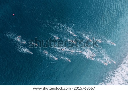 Aerial view of athletes at open water sea swimming competitions Royalty-Free Stock Photo #2315768567